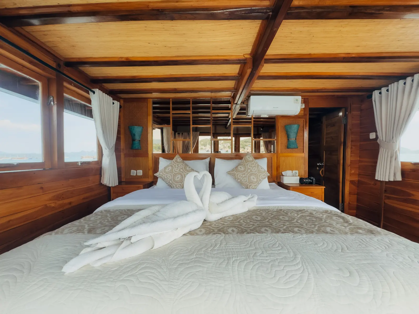 Master Cabin on Gammara, upper deck, with a king bed and windows to the sea